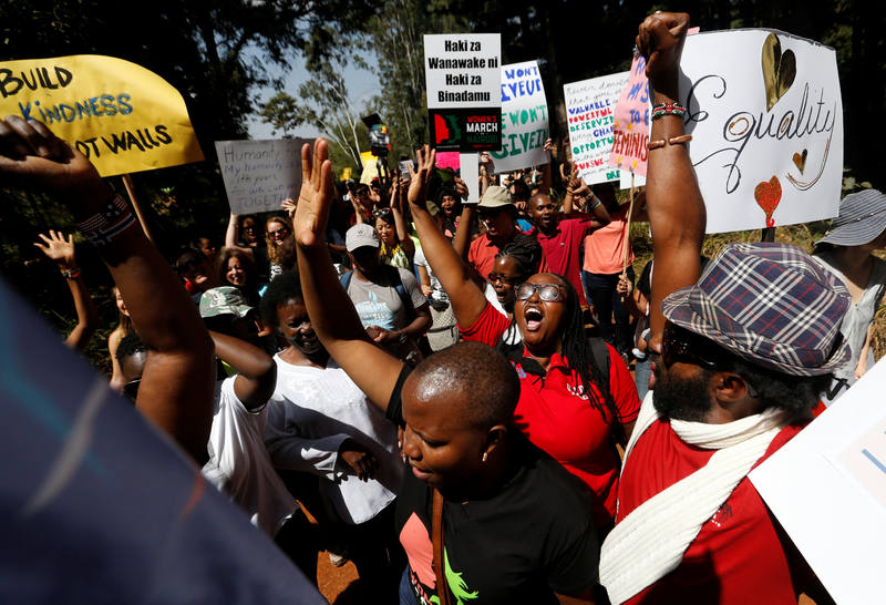 Demonstrators protest against U.S. President Donald Trump during the Women's March inside Karura forest in Kenya's capital Nairobi